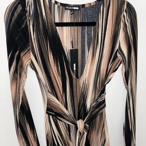 Brand New - Snitches the waist creating a beautiful shape.